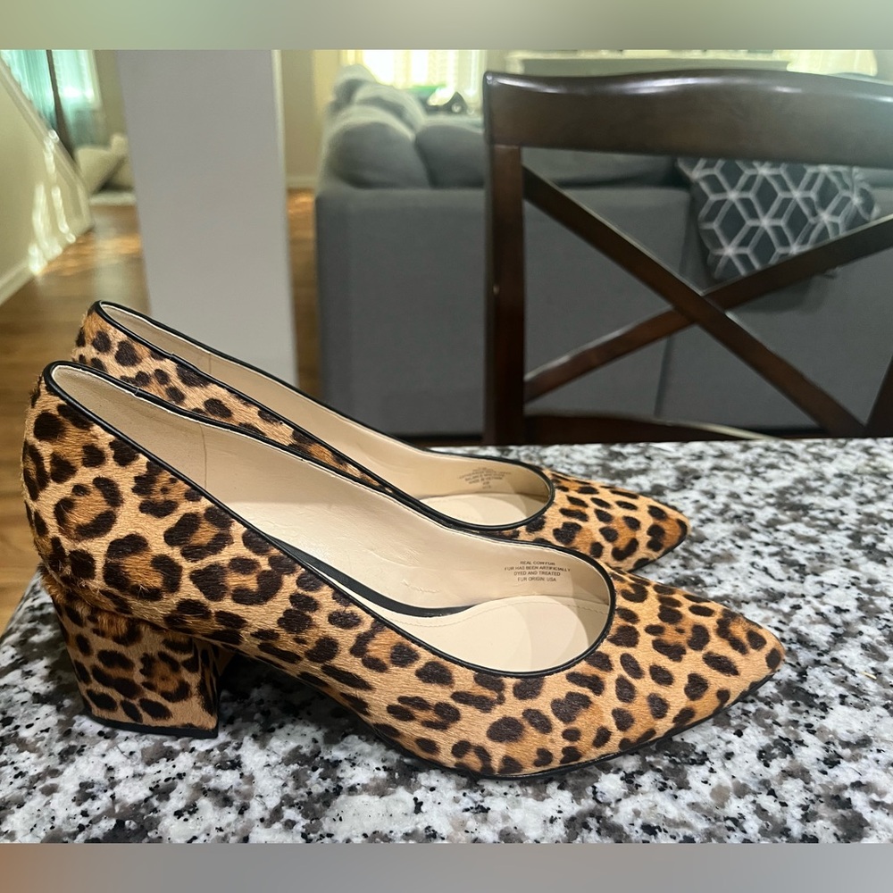 Nine West woman’s faux fur 7 1/2 cheetah print shoes with a stacked heel